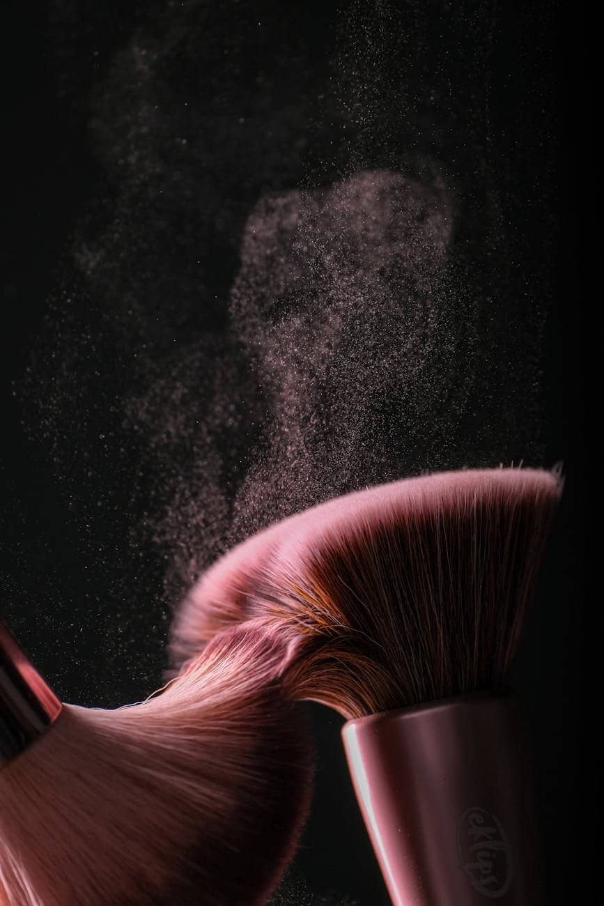 Long-lasting foundation: makeup brushes on black background