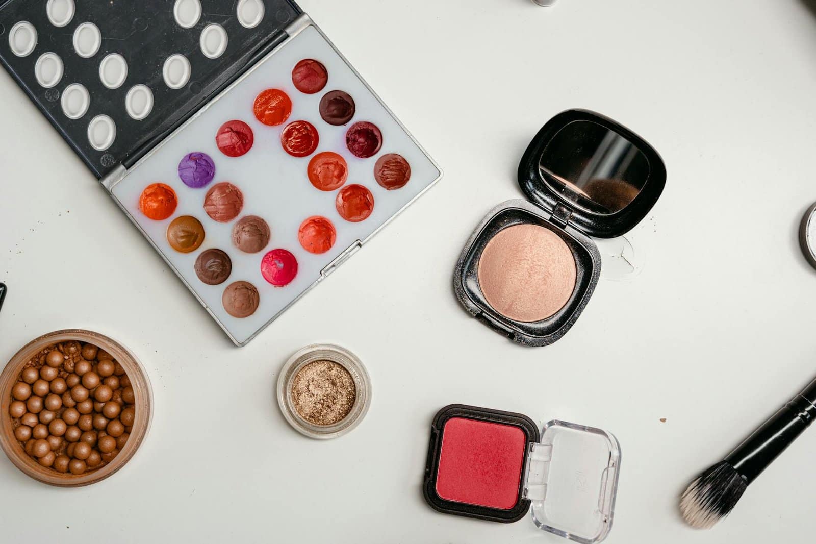 color palette makeup set on white surface