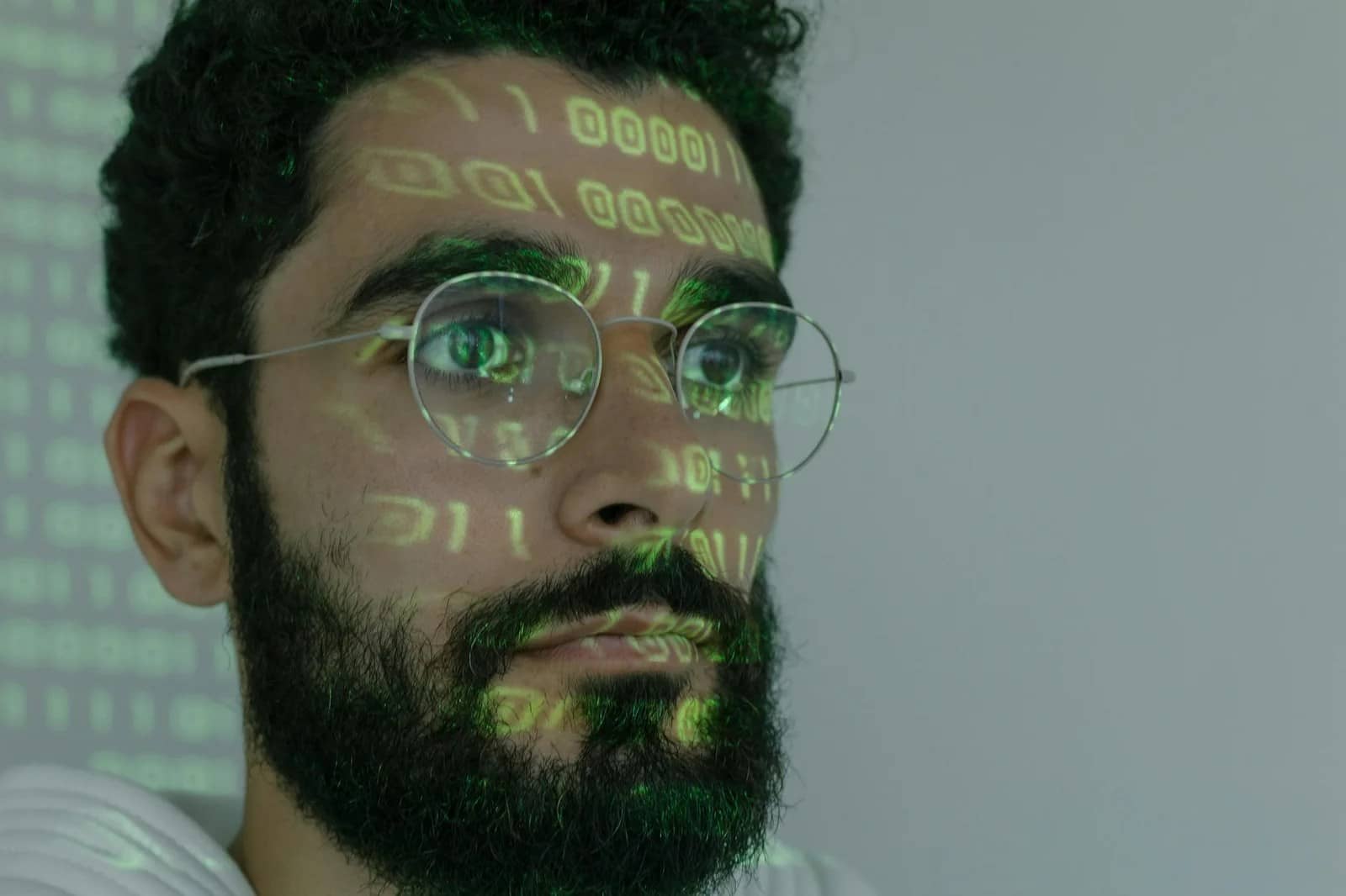 man in white crew neck shirt wearing silver framed eyeglasses: Best free AI software