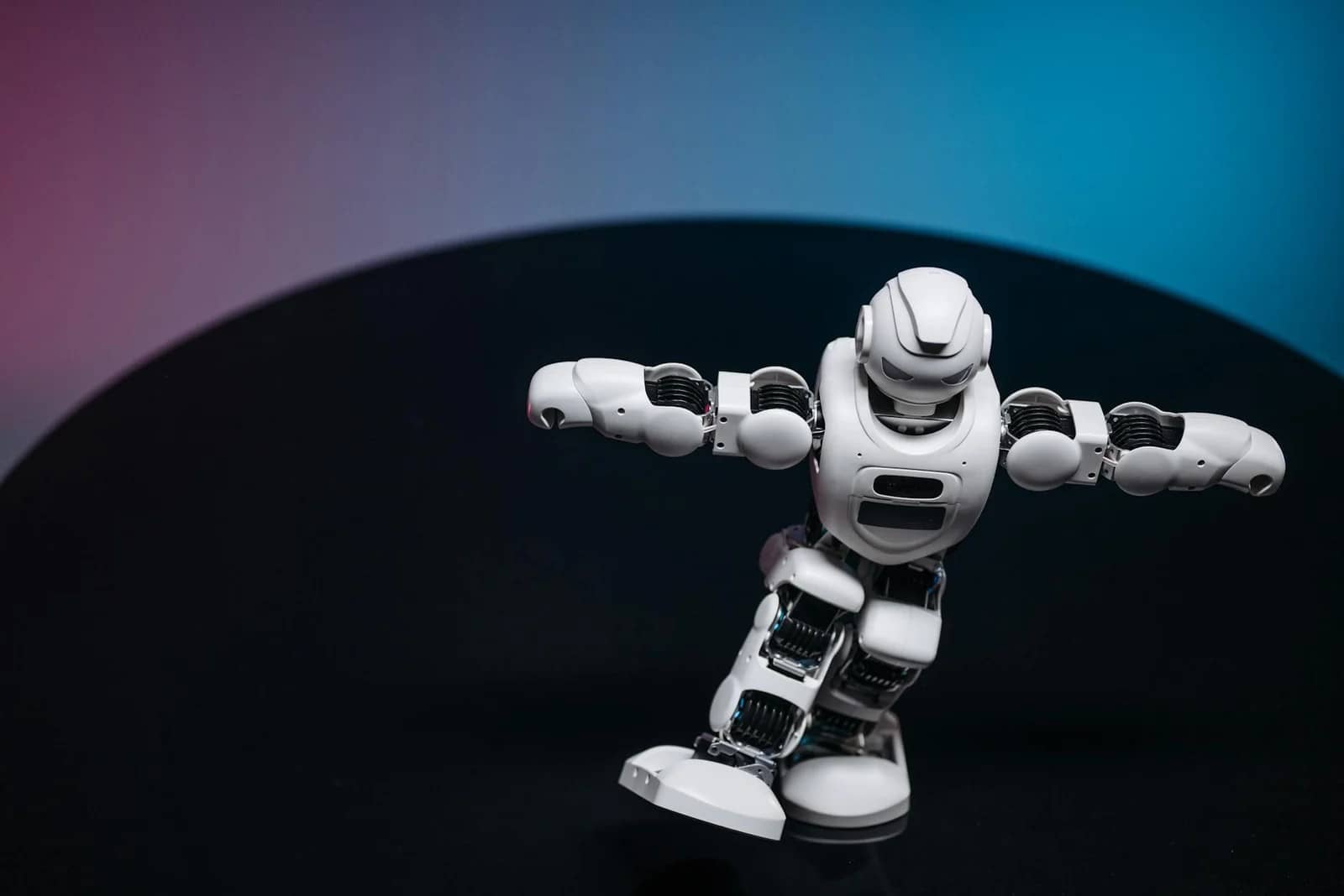 white toy robot on black surface: Best free AI software
