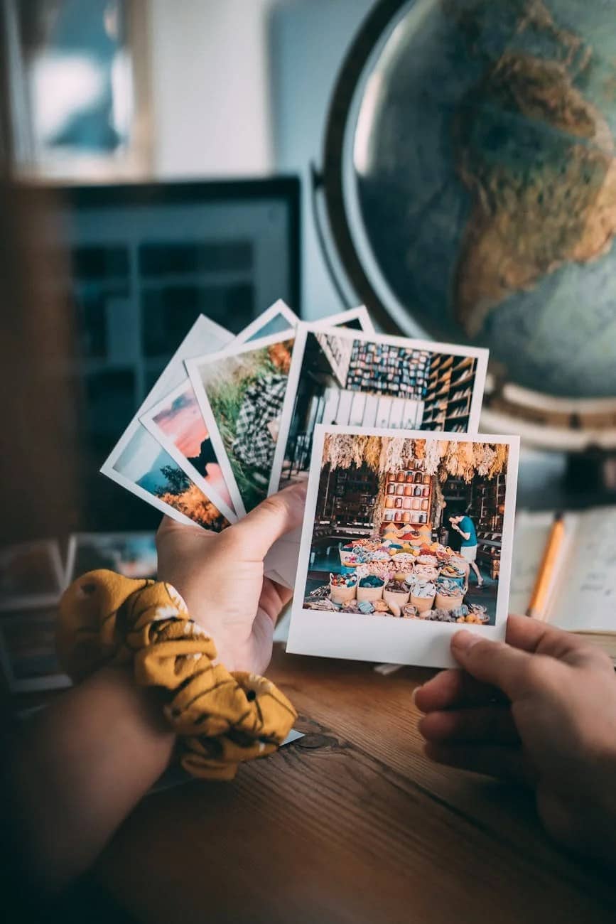 person holding white and black labeled book