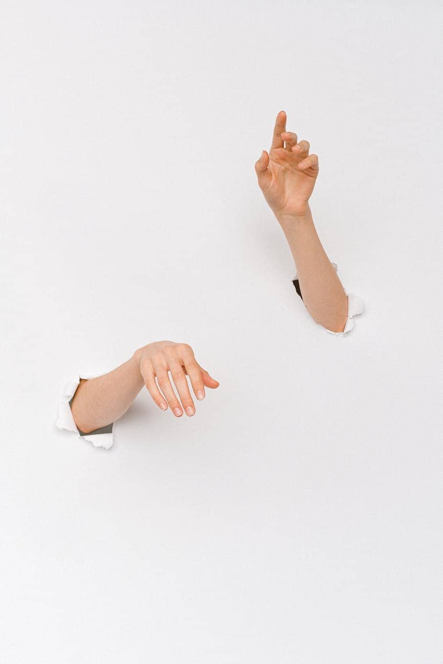 a person s hands through a hole - Menopause symptoms